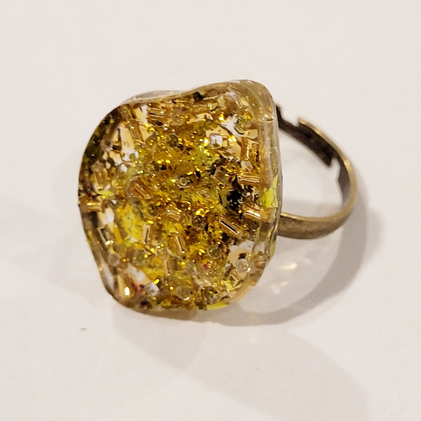 a ring with a yellow substance inside of it