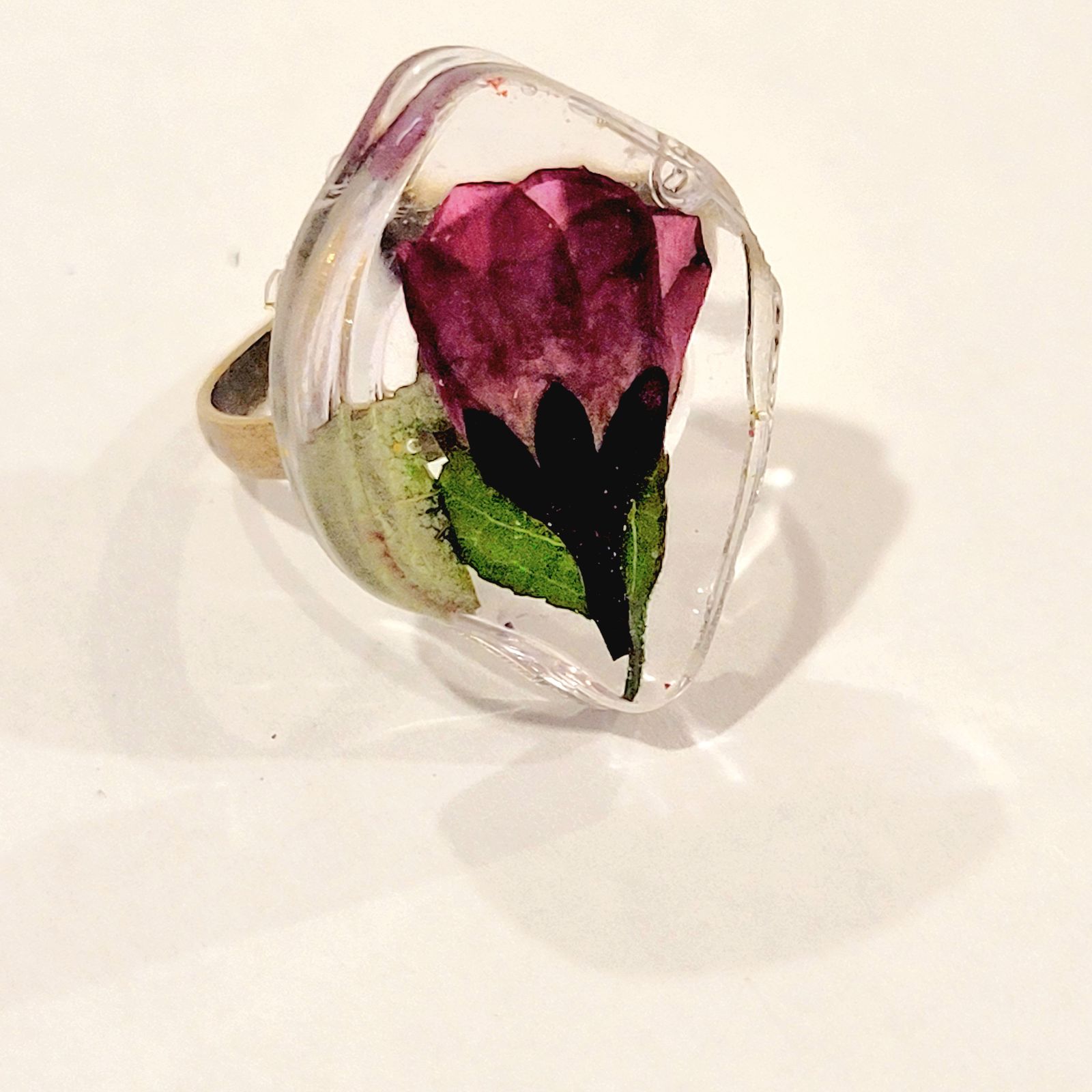a ring with a flower inside of it