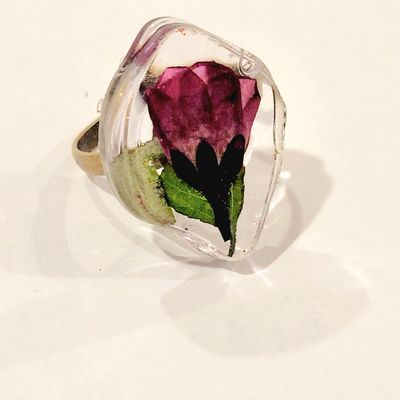 a ring with a flower inside of it