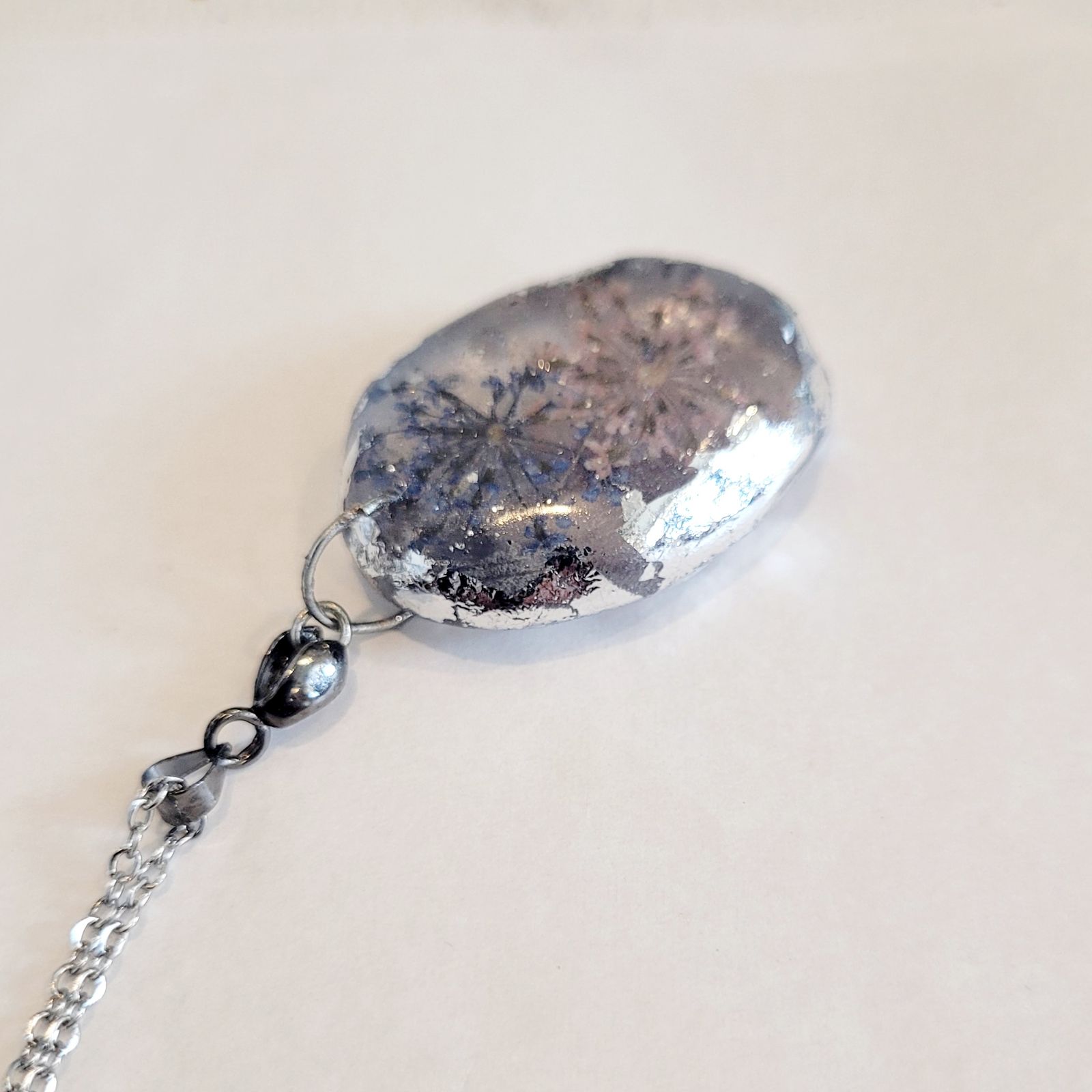 a piece of jewelry with a chain attached to it