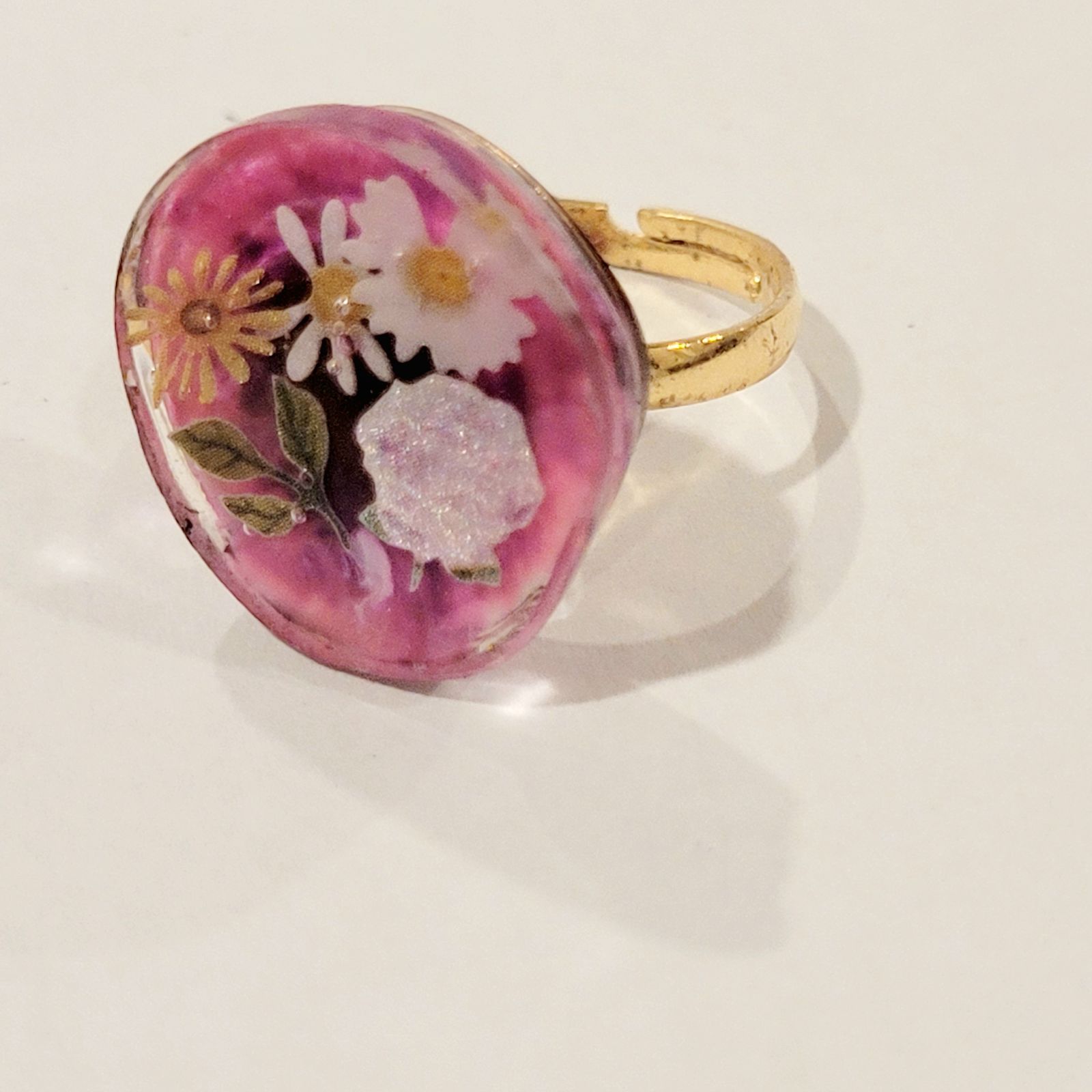 a close up of a ring with flowers on it