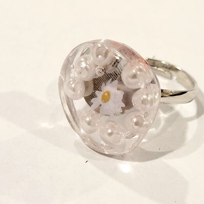 a ring with a flower inside of it