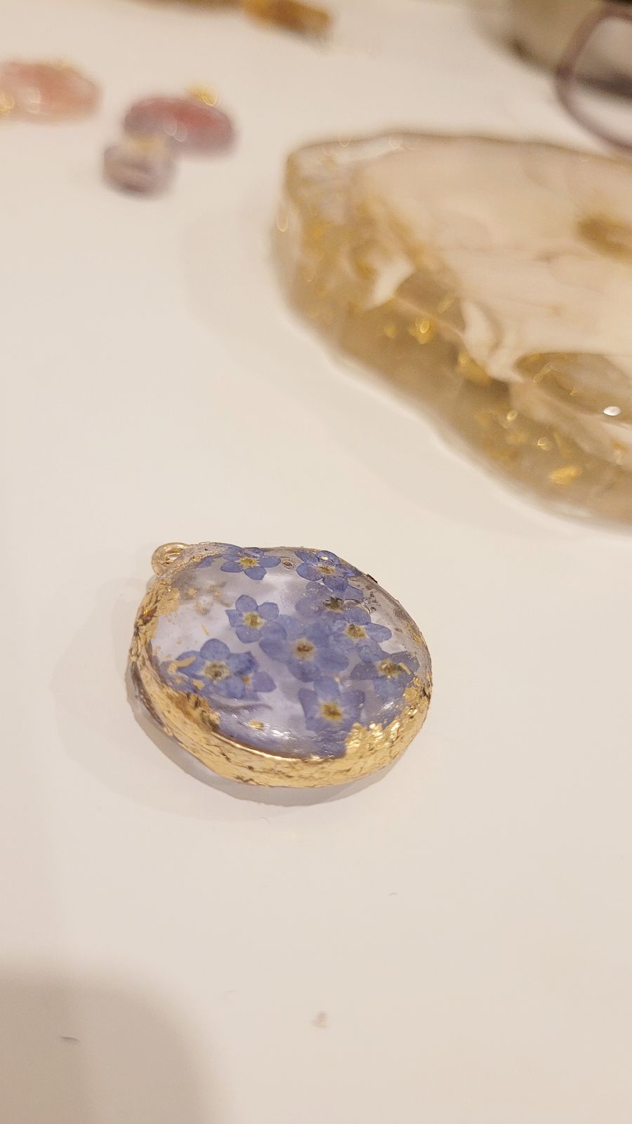 a close up of a piece of jewelry on a table
