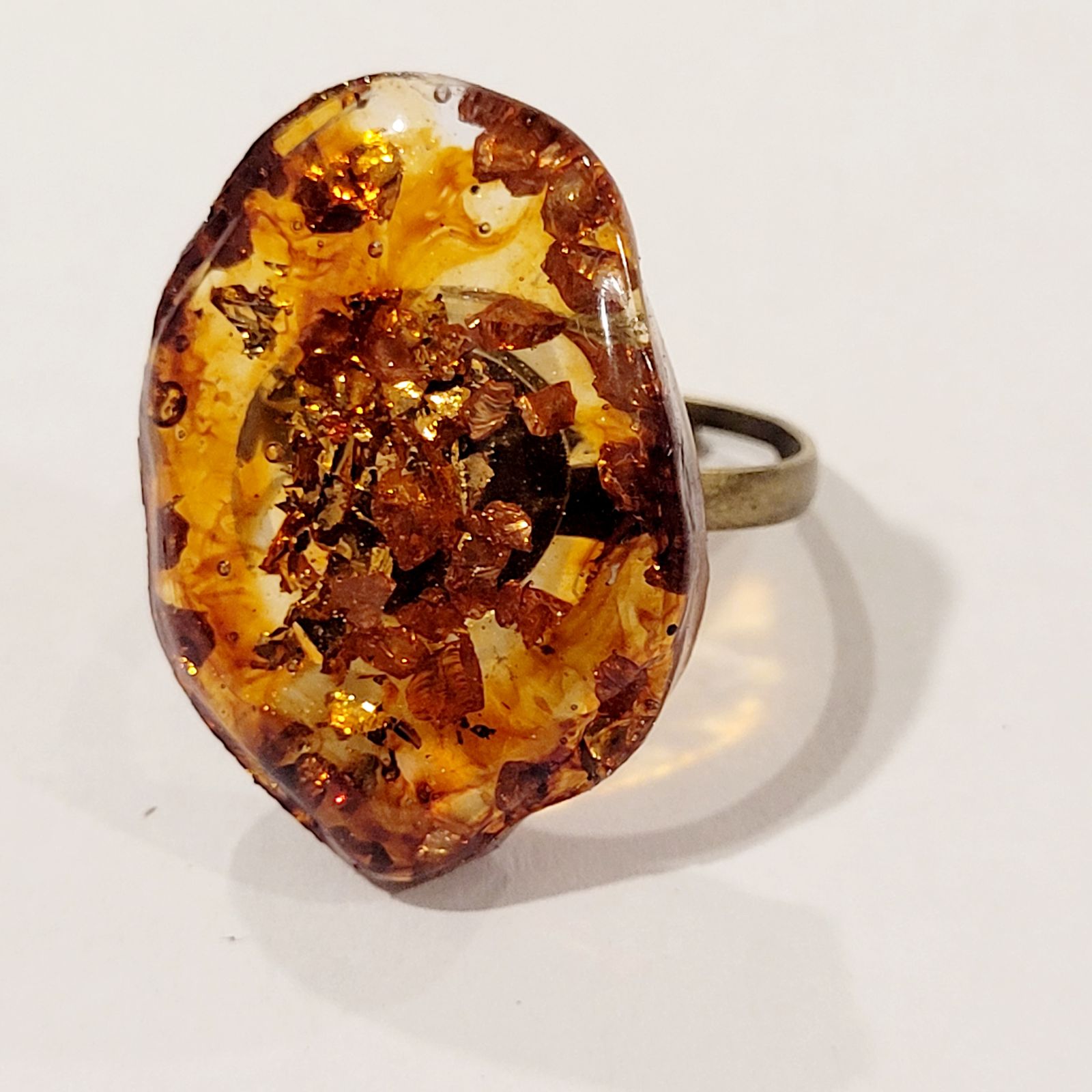 a close up of a ring on a white surface