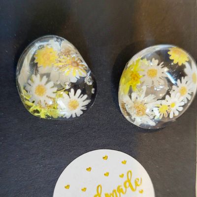 a couple of glass magnets sitting on top of a table