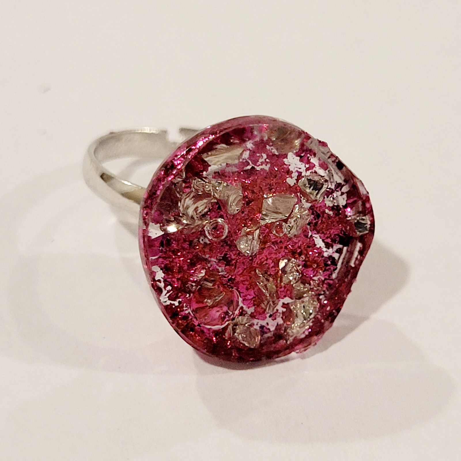 a close up of a ring on a white surface