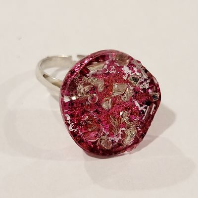 a close up of a ring on a white surface