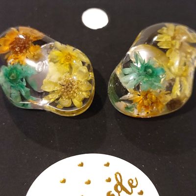 a couple of glass spoons sitting on top of a table