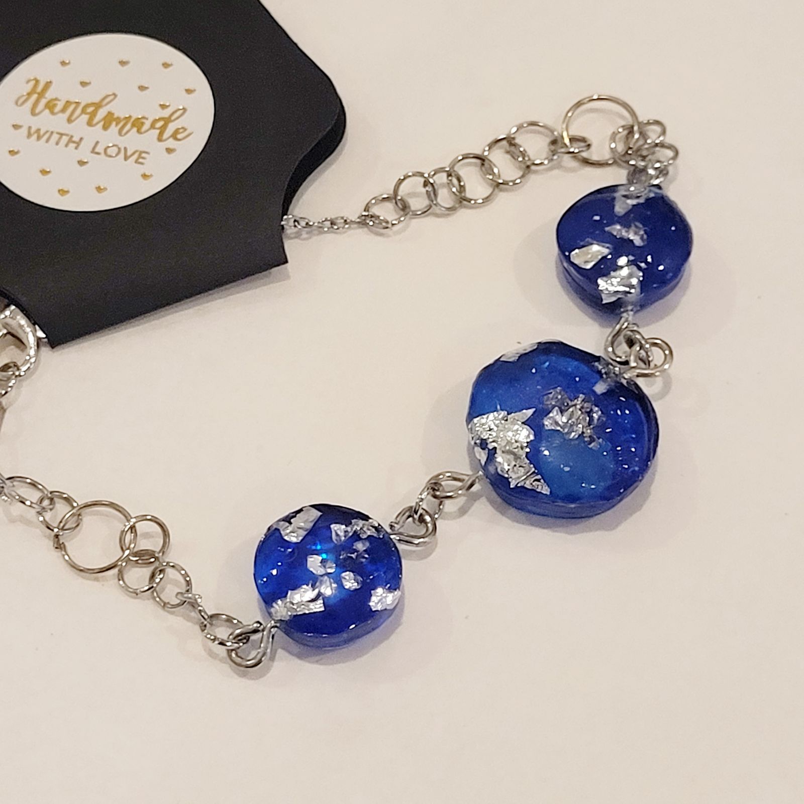 a close up of a bracelet on a table