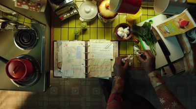 a person sitting at a table with a book