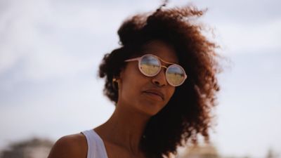 a woman with sun glasses on her face