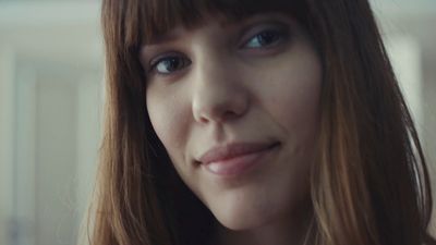 a close up of a person with long hair