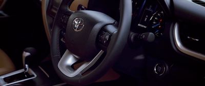 a close up of a steering wheel of a car