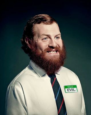 a man with a beard wearing a shirt and tie