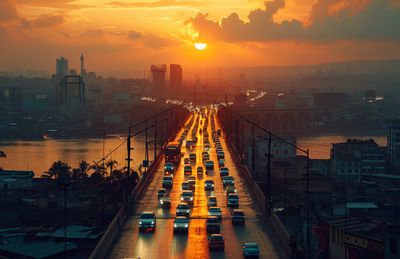 a sunset view of a highway with a lot of traffic