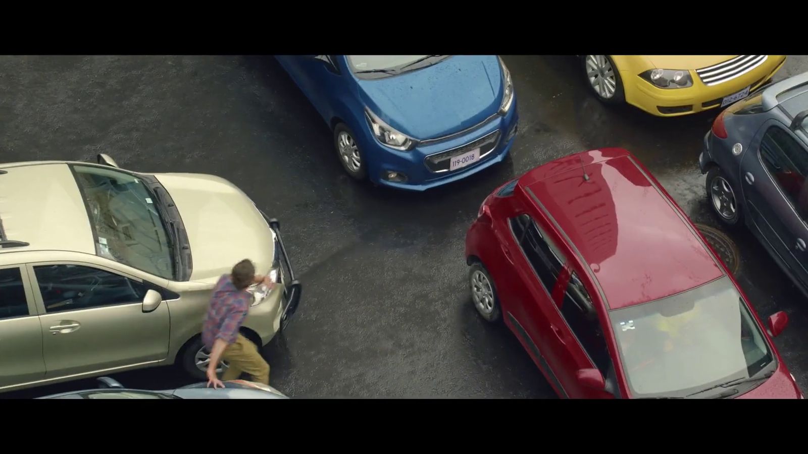 a group of cars parked next to each other in a parking lot