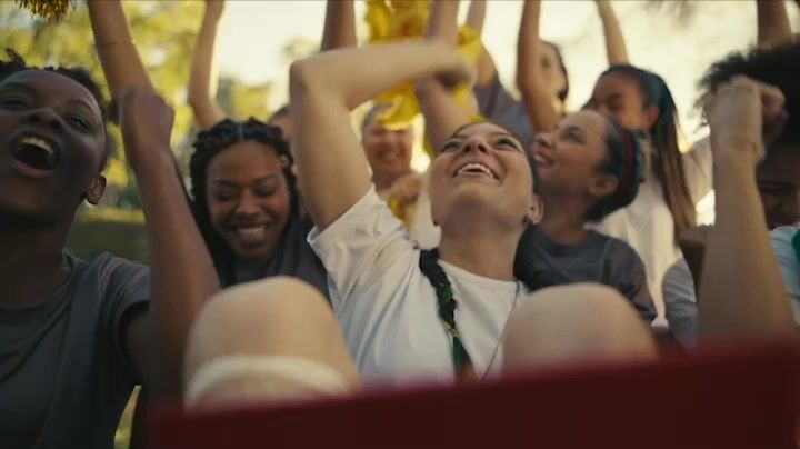 a group of people holding up their hands in the air