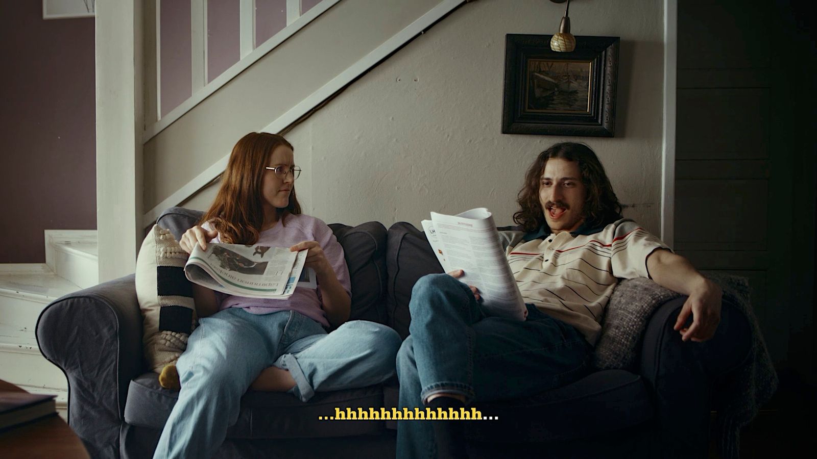 a man and a woman sitting on a couch