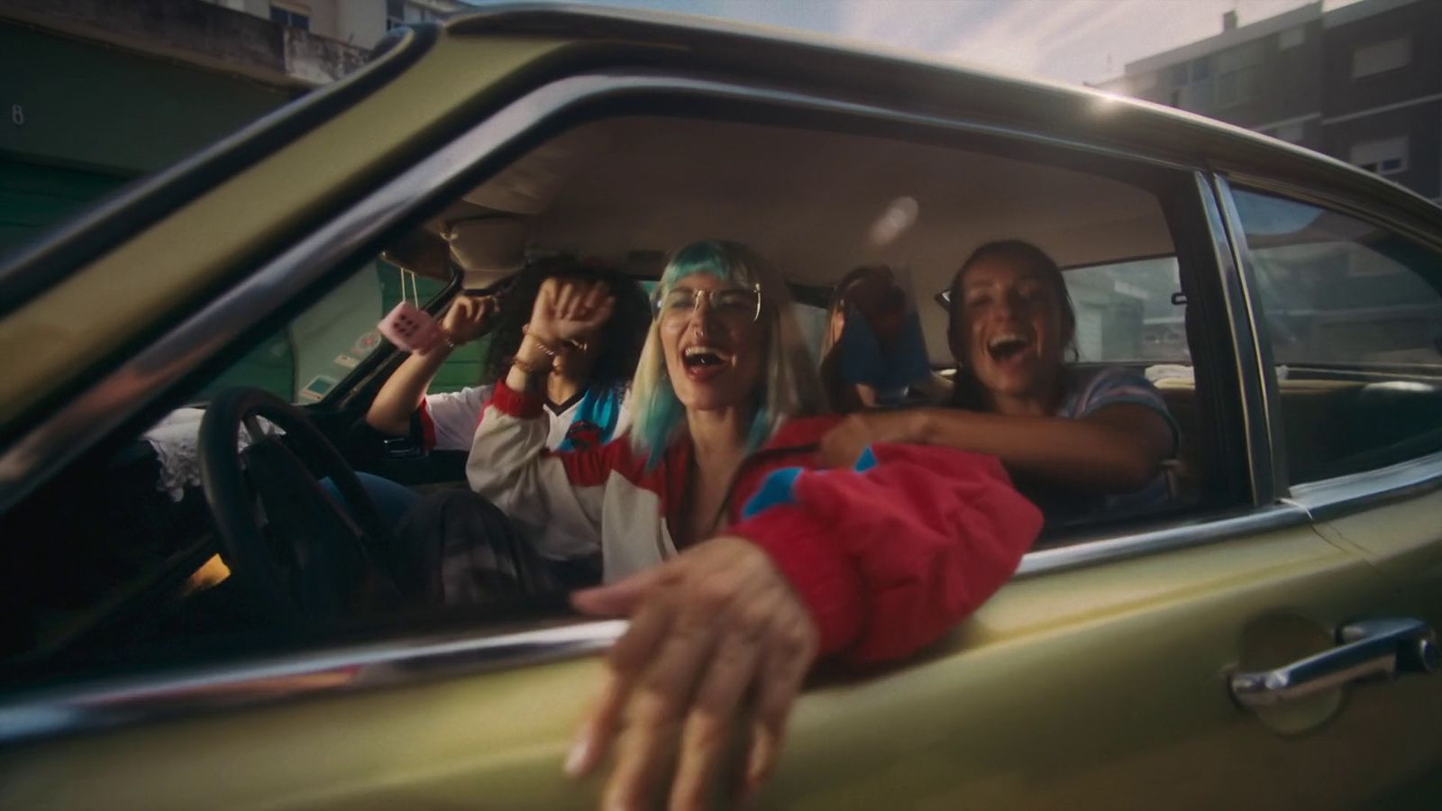 a group of people sitting in the back of a car