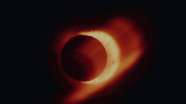 a close up of a ring of fire in the dark