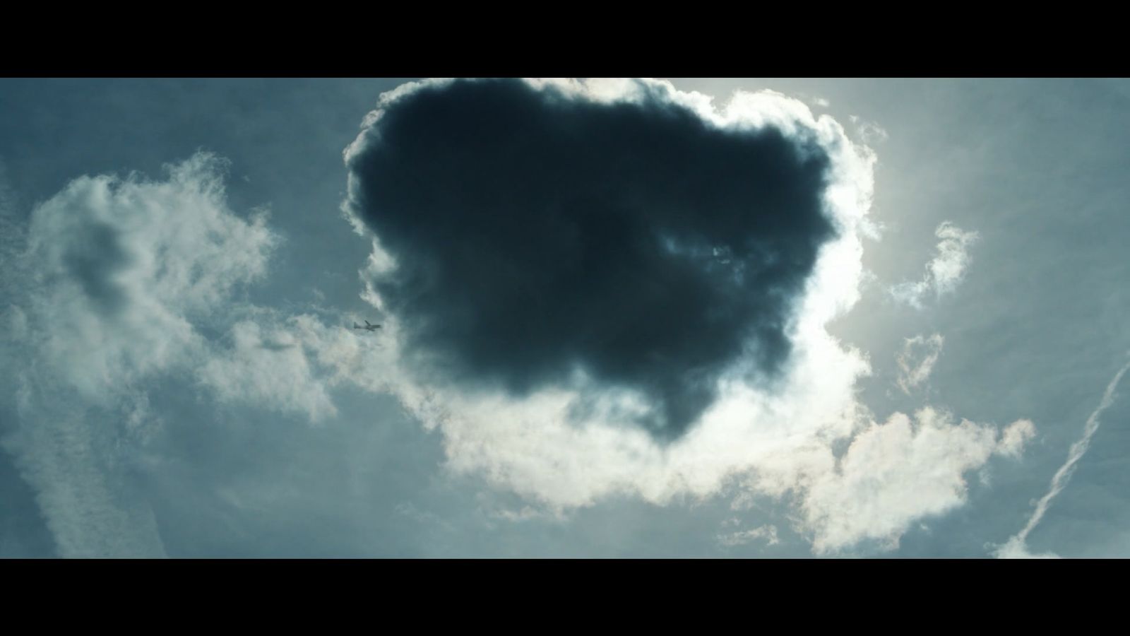 a cloud shaped like a heart in the sky