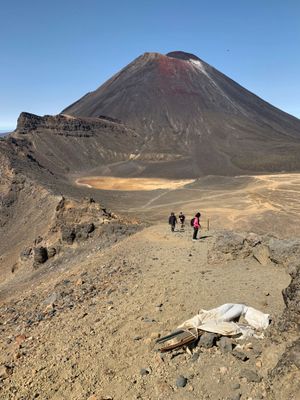 a group of people standing on top of a mountain