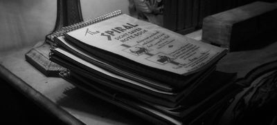 a stack of papers sitting on top of a table