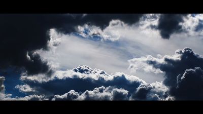 a group of clouds that are in the sky