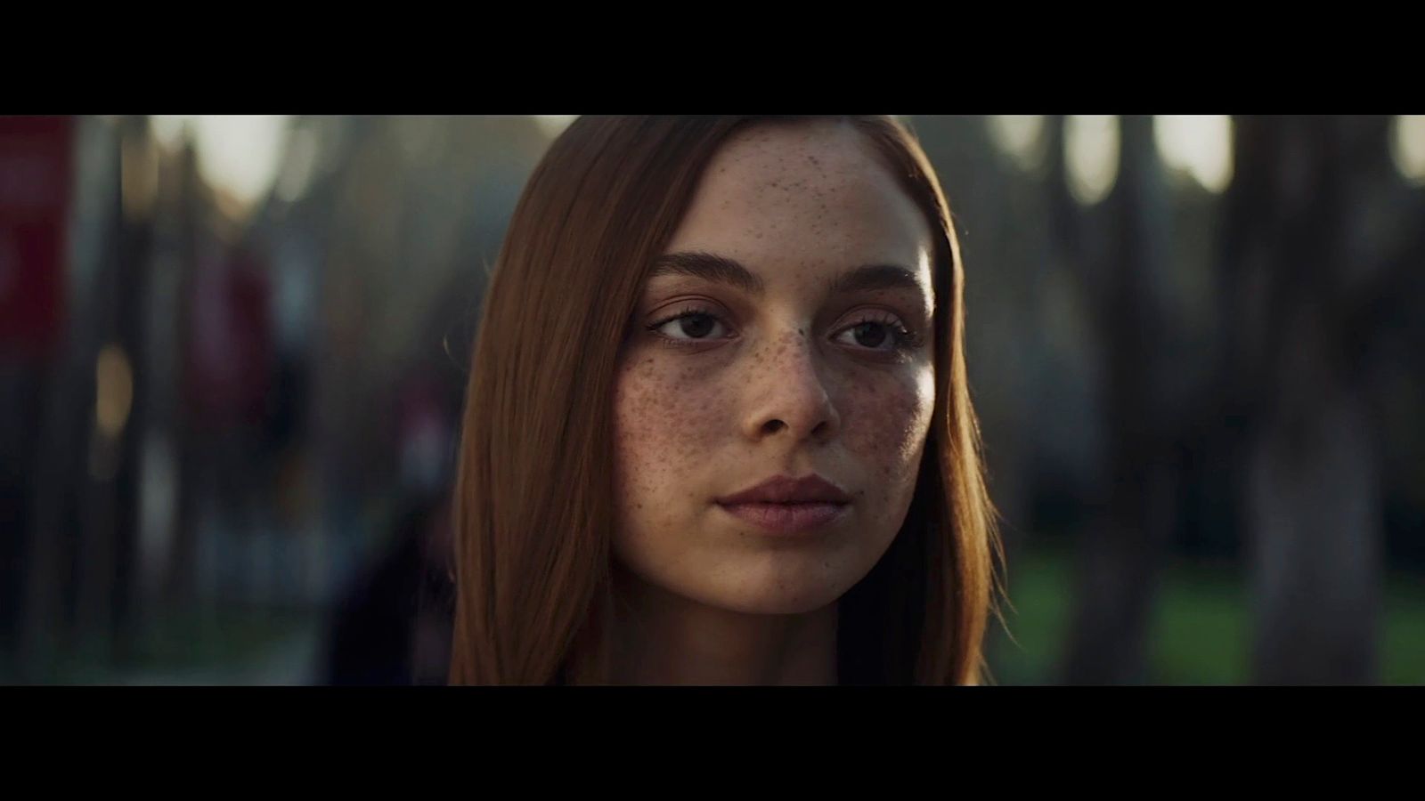 a woman with freckles and freckles on her face