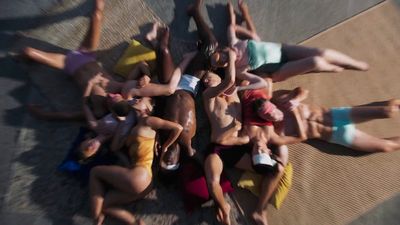 a group of people laying on top of each other