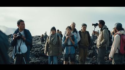 a group of people standing on top of a mountain