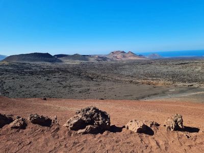 a desert landscape with mountains in the background