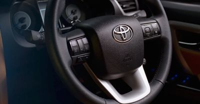 a close up of a steering wheel of a car