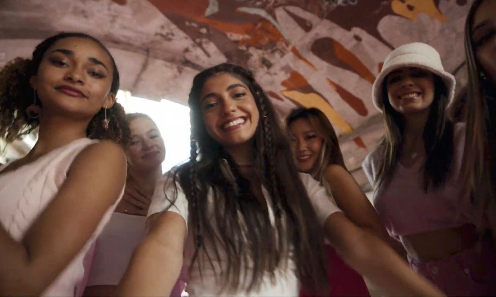 a group of young women standing next to each other