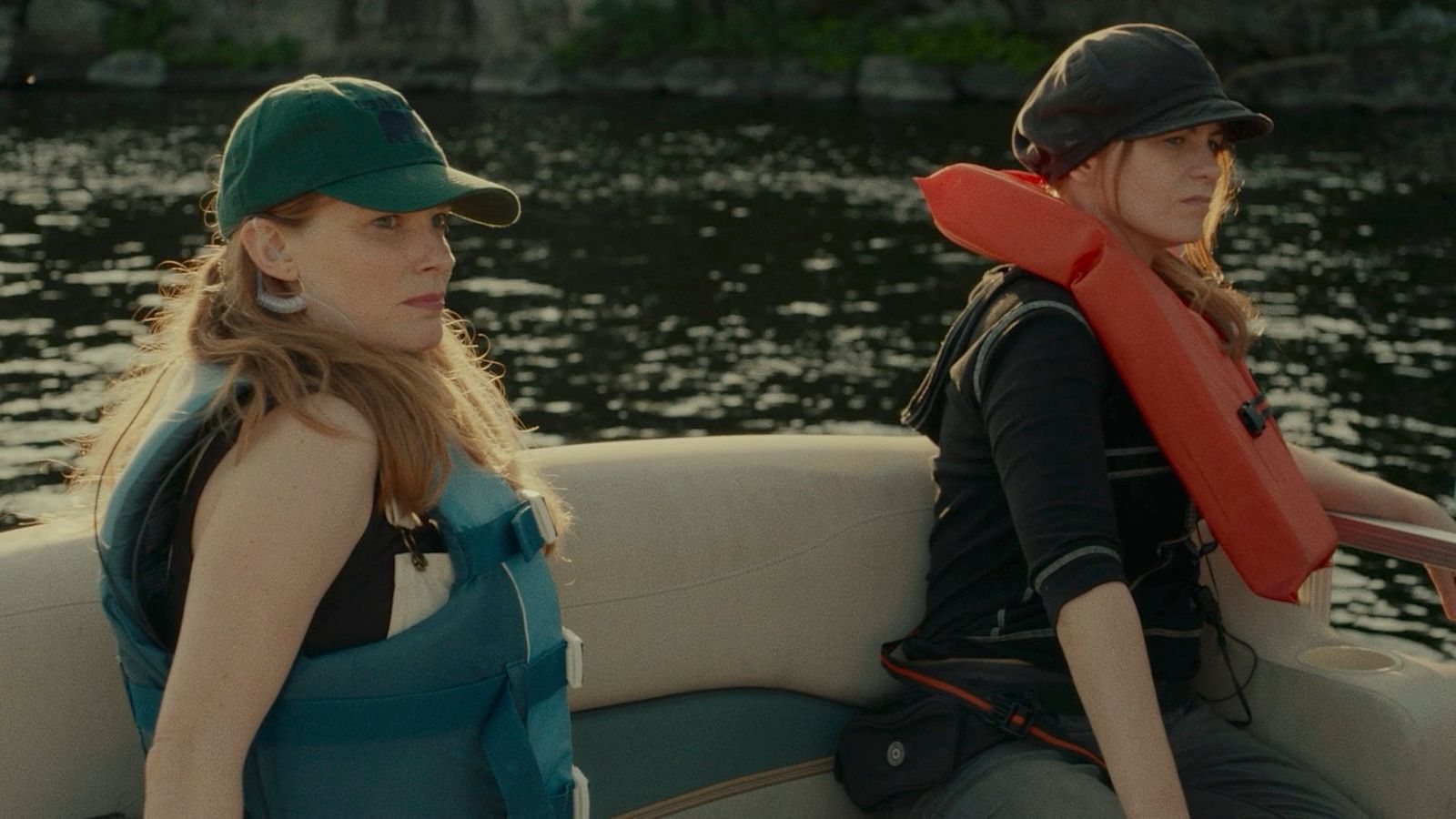 a couple of women sitting on top of a boat