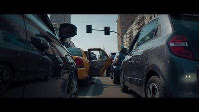 a group of cars that are sitting in the street