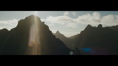 a group of people standing on top of a mountain