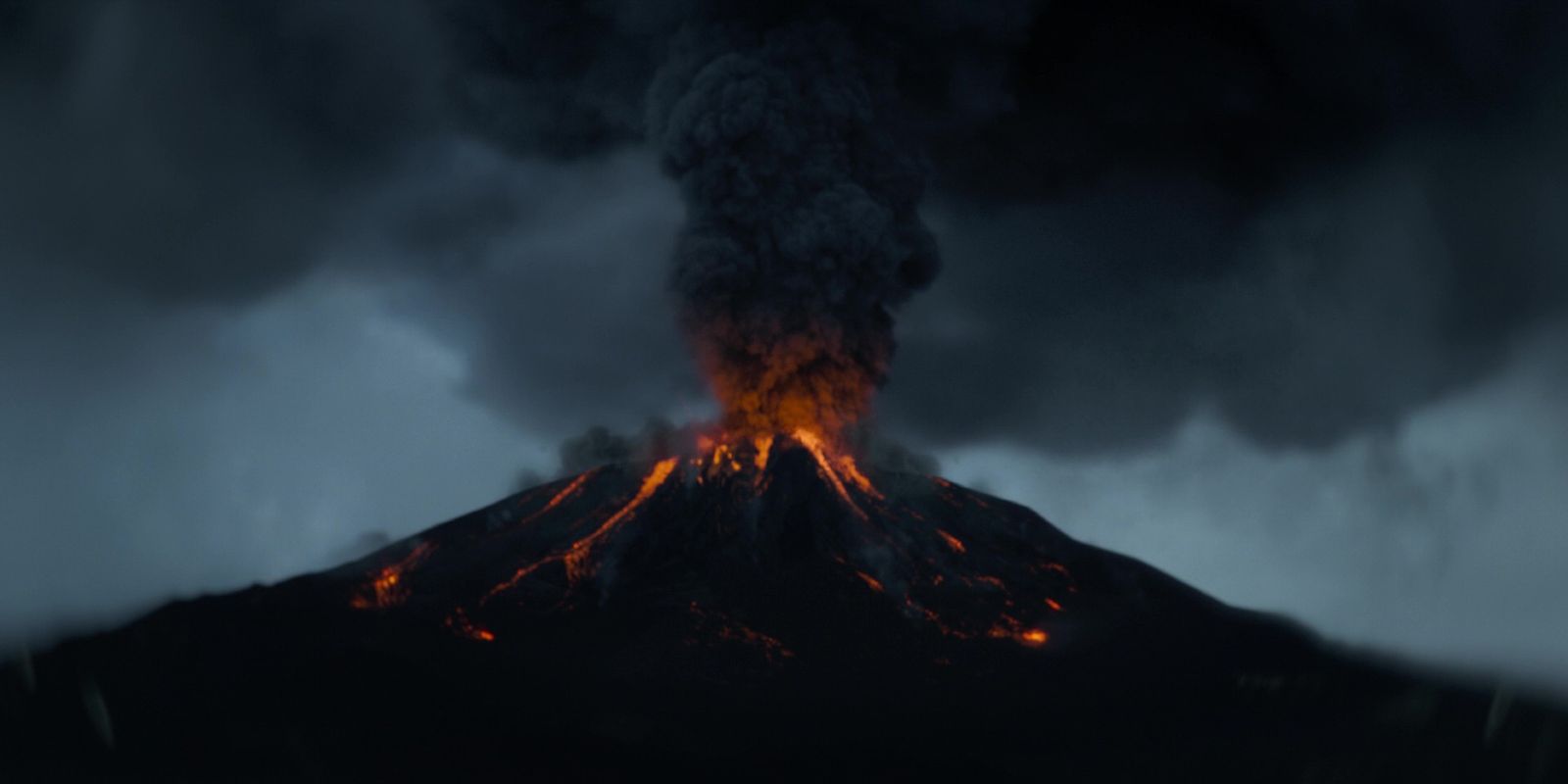 a volcano erupts smoke and lava as it erupts