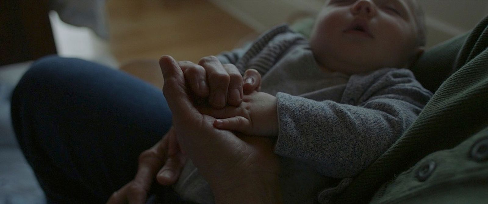 a woman holding a small child in her arms