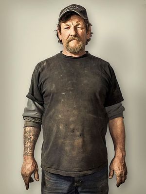 a man in a black shirt and a hat