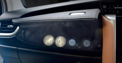 a close up of a car door handle with buttons