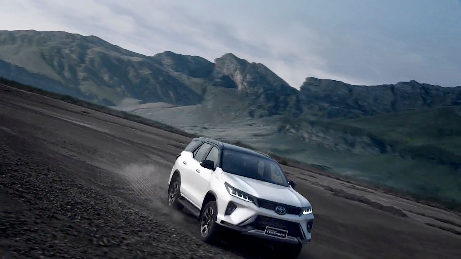 a white car driving down a dirt road