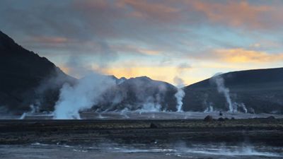 a group of geysers spewing water into the air