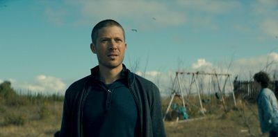 a man standing in front of a playground