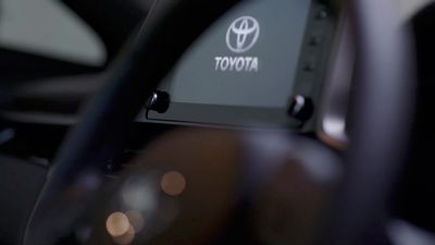 a close up of a toyota logo on a car dashboard