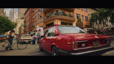 a red car parked on the side of a street