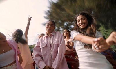 a group of women standing next to each other