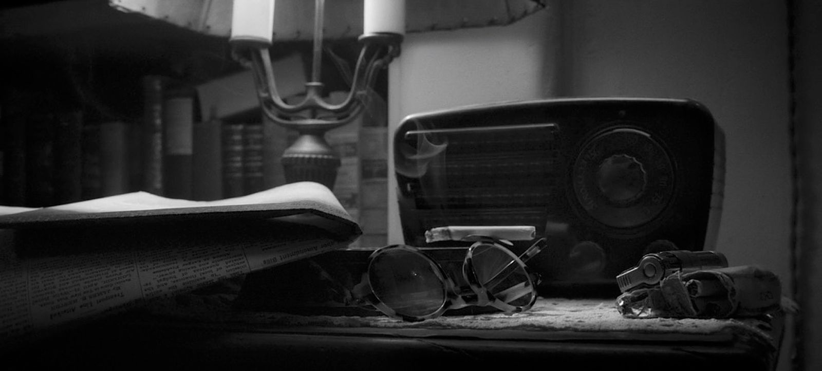 a pair of glasses sitting on top of a table