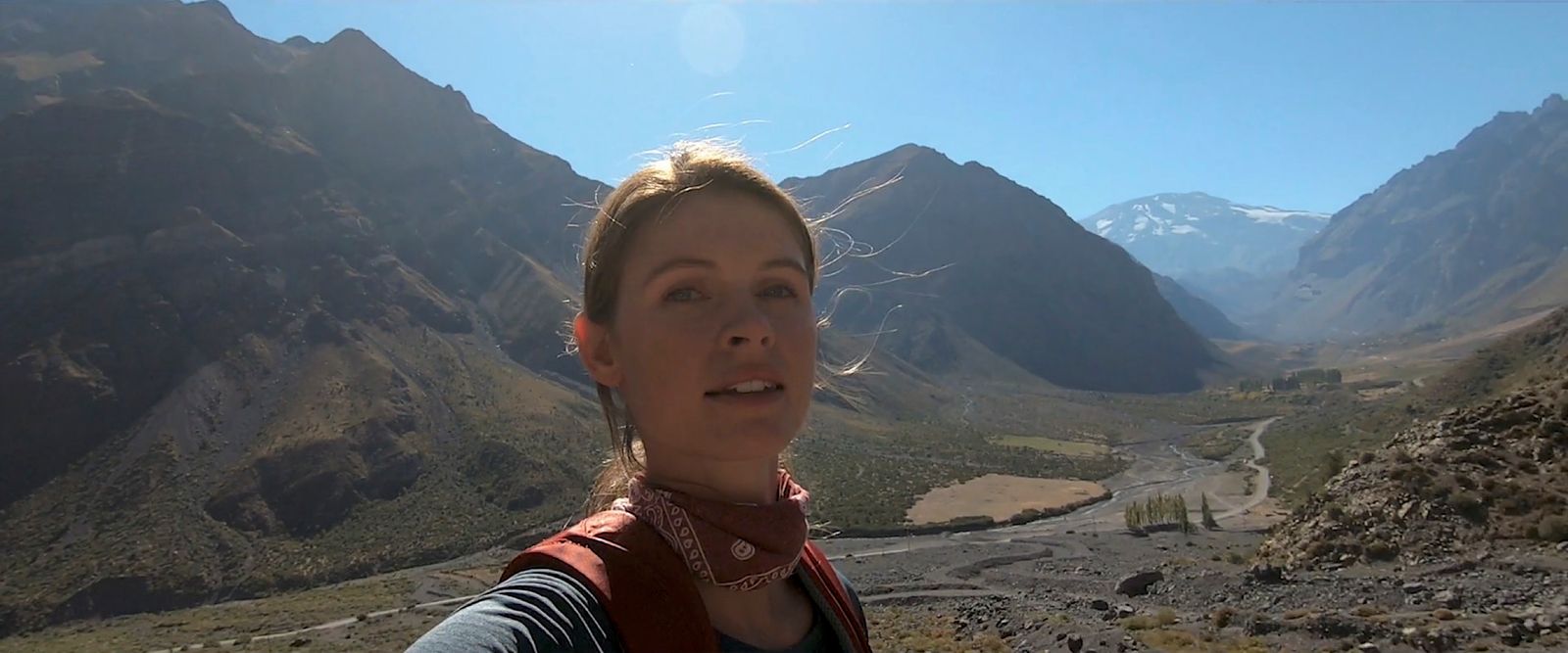 a woman taking a selfie in the mountains