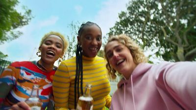 a group of young women standing next to each other